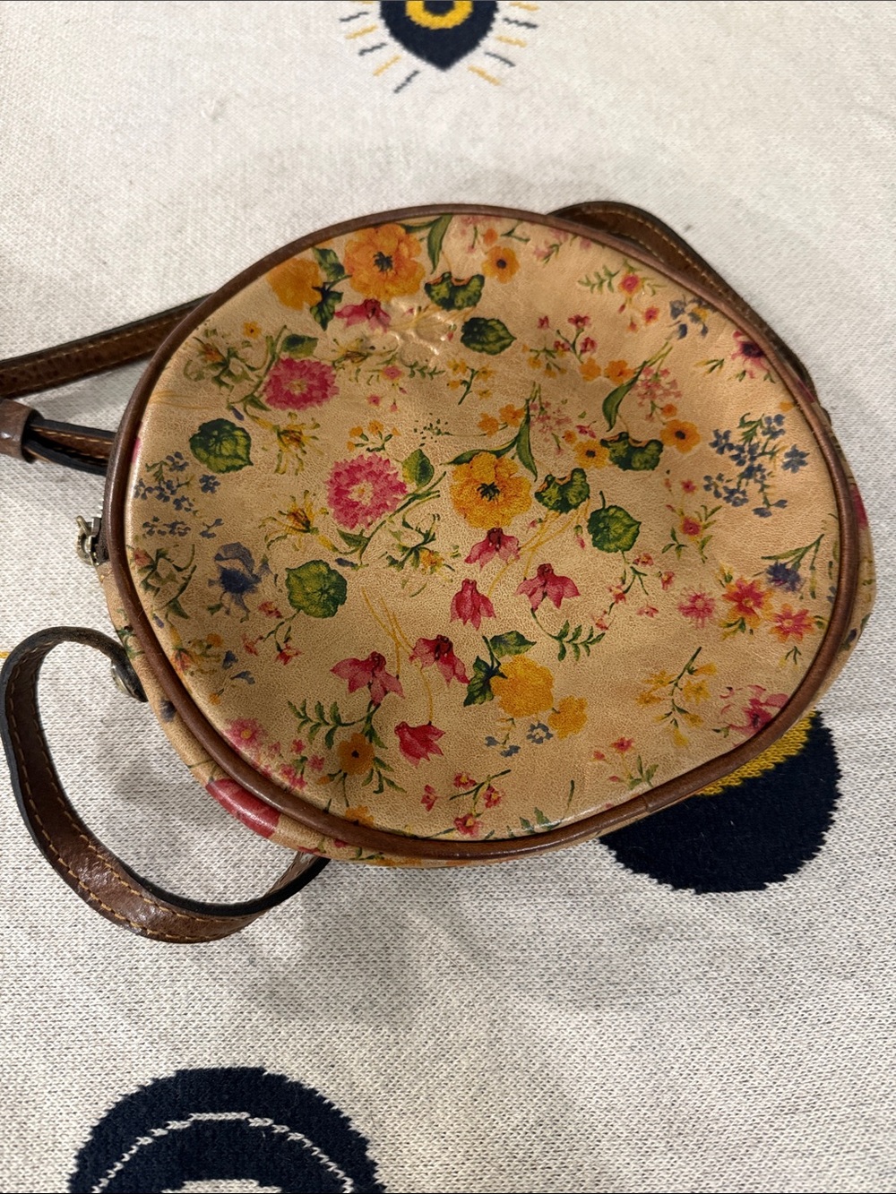 The Patricia Nash Scafati Round Crossbody Bag in the Prairie Rose Print